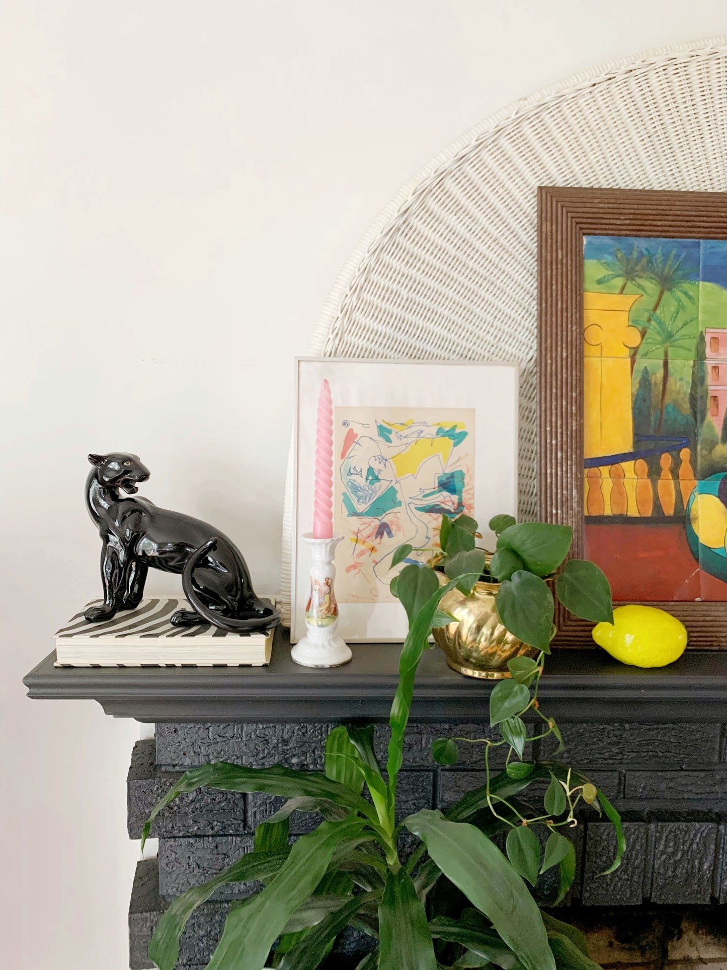 black panther statue with plants