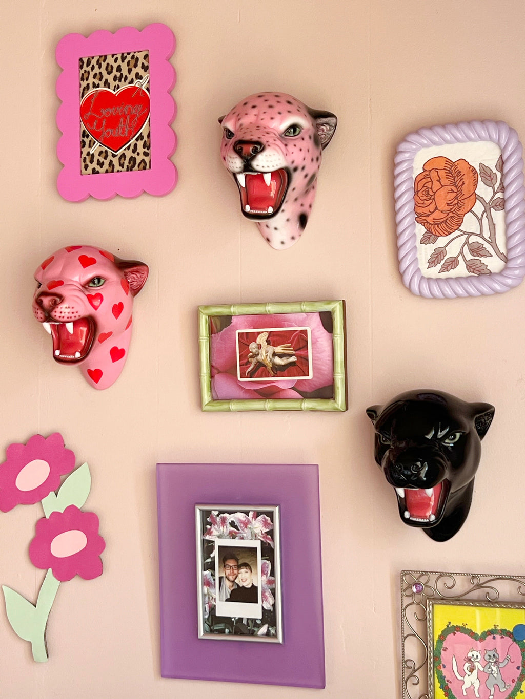 gallery wall with wall mounted leopard heads
