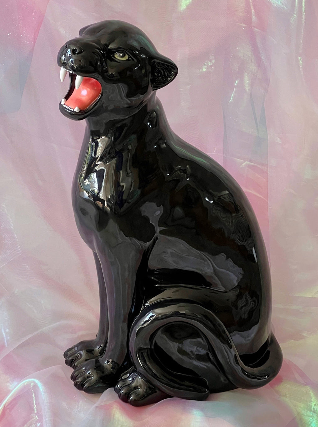 Black panther figurine on a colorful, translucent background