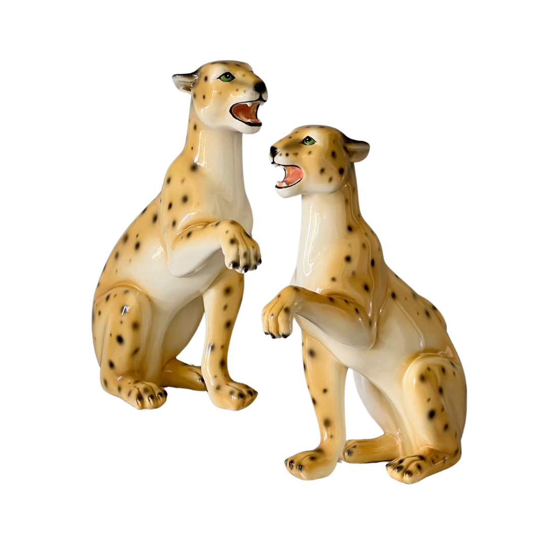 two small leopard statues transparent background