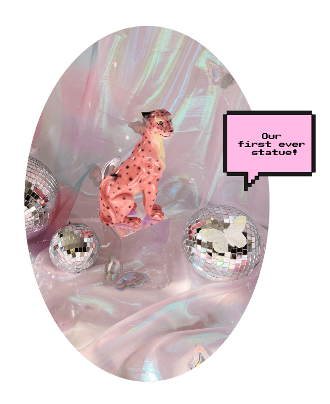pink leopard statue with disco balls 