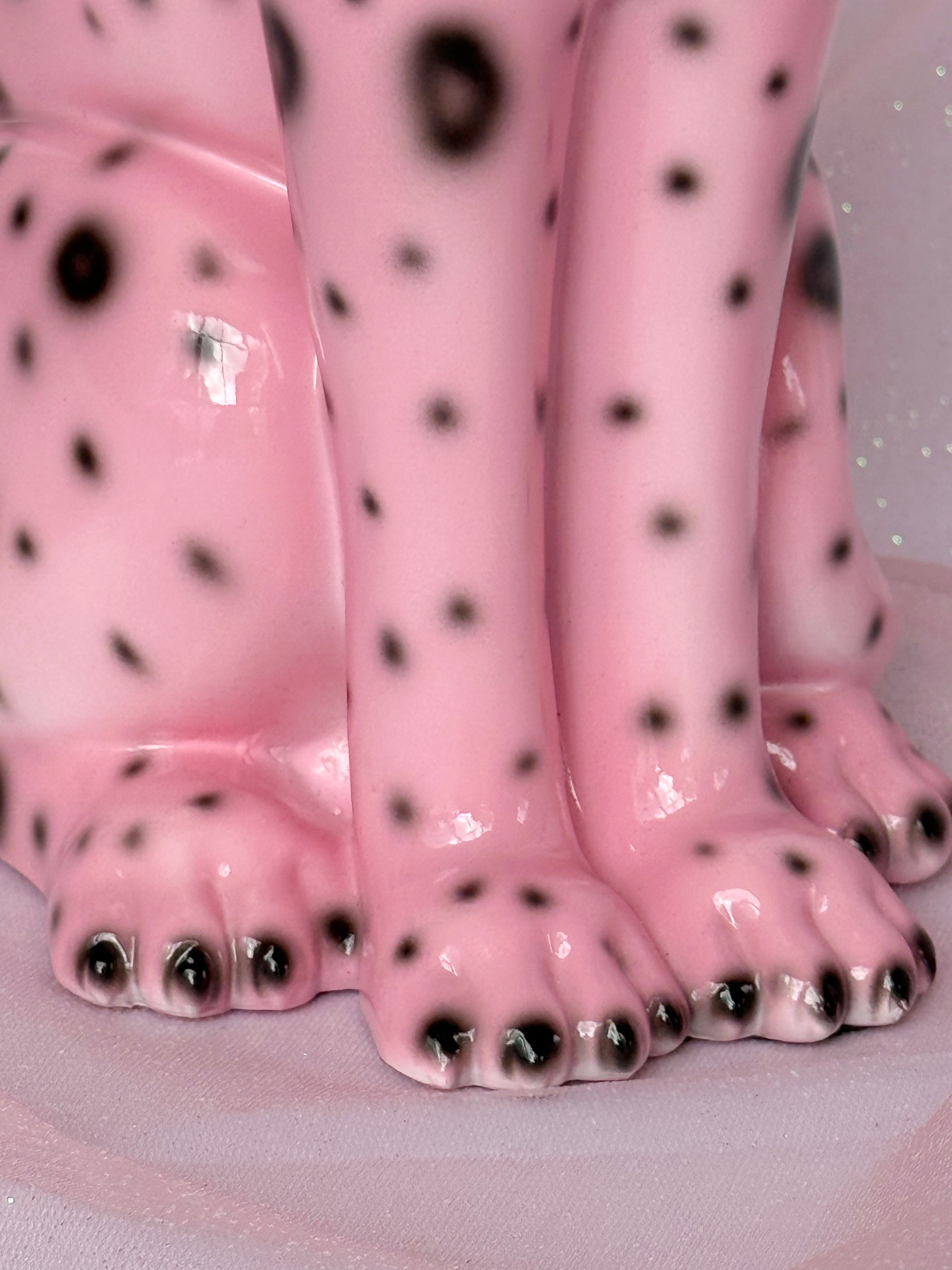 close up of resin pink leopard figurine 