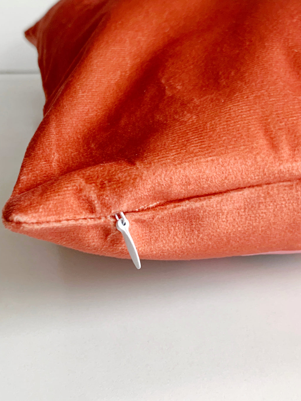 close up rust cushion cover